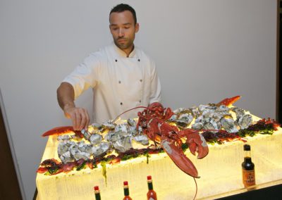 Fay-Campbell-Events-Crown-Plaza-Chef-setting-up-seafood